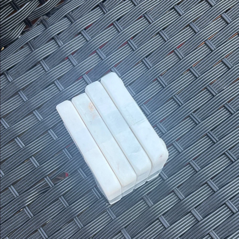 Stack of White Square Marble Coasters